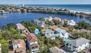 A coastal residential area with houses, a marina, and a beach. - Destiny Private Beach Home, Prime Location, Beach 350 yds, Golf Cart, Pool/HotTub/Tennis/Pickleball (Destin)