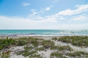 A beach with clear skies and calm sea. - Gulf, Beach, Pool View Balcony on Venice Beach (Venice)