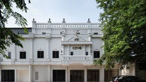 A white building with a balcony and the word "cove" on the facade. - Cove Veranda (Jakarta)