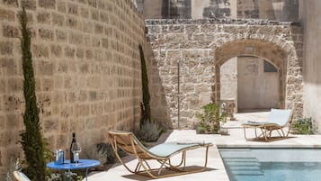 Indoor pool, outdoor pool, open 10:00 AM to 7:30 PM, pool umbrellas