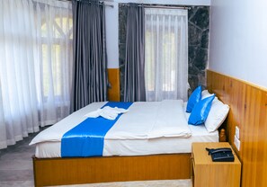 Standard Double Room | Memory foam beds, in-room safe, individually decorated, blackout drapes - Roamers Inn - Hostel (Pokhara)