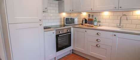 Fridge, electric kettle, toaster, cookware/dishes/utensils