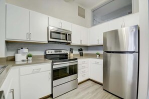 Fridge, microwave, oven, stovetop - CozySuites - 2BR with Direct Skybridge Access #2 (Indianapolis)