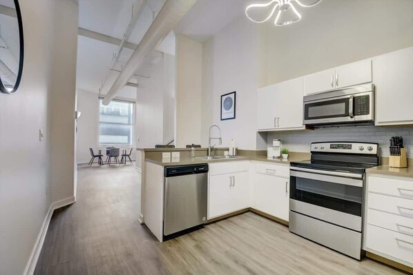 Fridge, microwave, oven, stovetop - CozySuites - 2BR with Direct Skybridge Access #2 (Indianapolis)