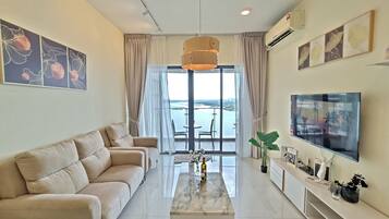 Exclusive Apartment, Sea View | Living area | 40-inch Smart TV with digital channels, offices