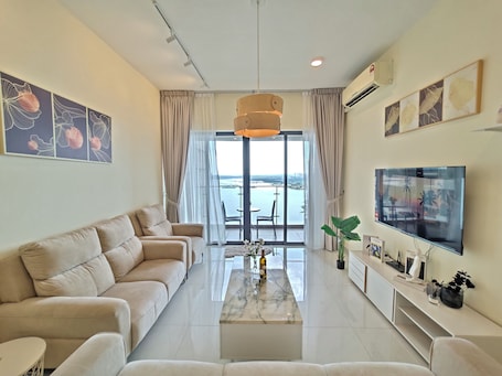Exclusive Apartment, Sea View | Living area | 40-inch Smart TV with digital channels, offices