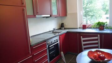 Fridge, stovetop, dishwasher, coffee/tea maker