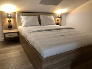 1 غرفة نوم ومكواة/لوح كي وواي فاي وملاءات أسرّة