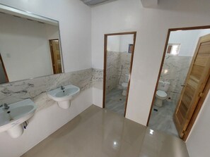 A bathroom with two sinks, a mirror, and a toilet. - CMJ Private Resort  (Indang)