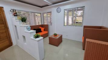 Villa | Living area | 32-inch flat-screen TV with cable channels