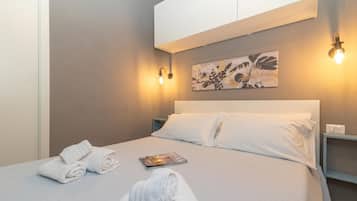 Apartamento família, vários quartos (White Sand House) | 1 quarto, Wi-Fi de cortesia, roupa de cama
