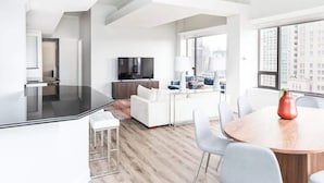 A modern apartment with a kitchen, dining area, and living room. - Luxury Designer Penthouse 3801 | Pool | Gold Coast (Chicago)