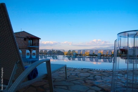 Seasonal outdoor pool, open 9:30 AM to 8:30 PM, pool umbrellas