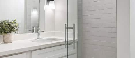 Shower, hair dryer, towels, shampoo
