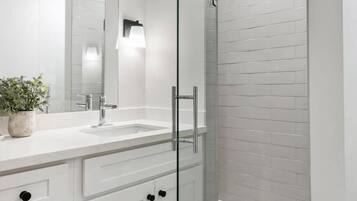 Shower, hair dryer, towels, shampoo