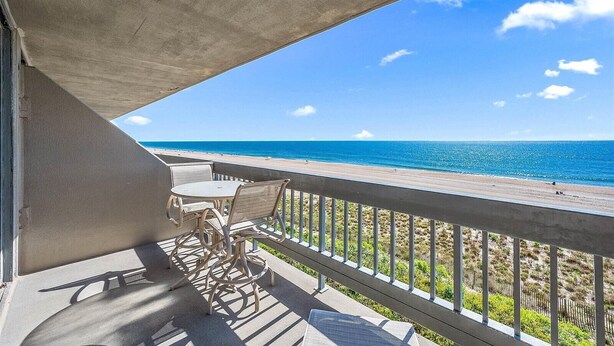 A balcony with a view of the beach and ocean. - Beautiful 2 Bedroom Condo At Century I With Indoor Pool (Ocean City)