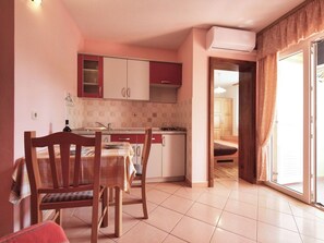 Fridge, microwave, coffee/tea maker, cookware/dishes/utensils