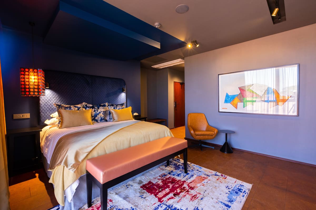 Deluxe Room, 1 King Bed, Garden View | In-room safe, desk, laptop workspace, iron/ironing board (on request)