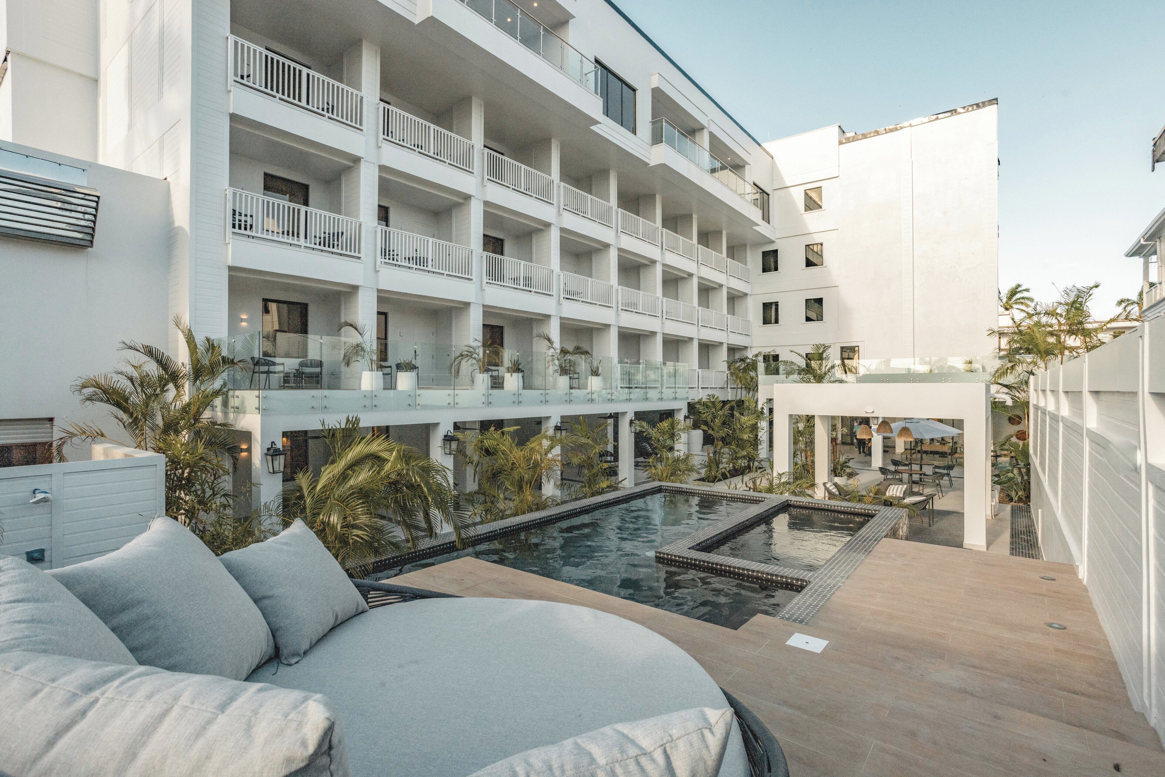 Outdoor pool, open 7:00 AM to 11:00 PM, pool umbrellas, sun loungers