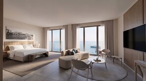 A modern hotel room with a large bed, a sofa, a TV, and a view of the sea. - Fort George Hotel & Spa (Belize City)