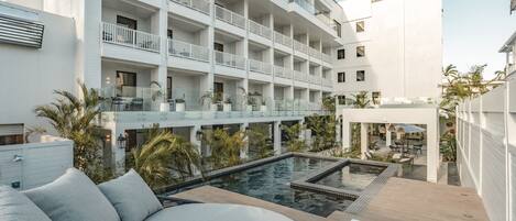 Outdoor pool, open 7:00 AM to 11:00 PM, pool umbrellas, pool loungers