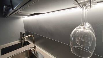 Fridge, microwave, stovetop, coffee/tea maker