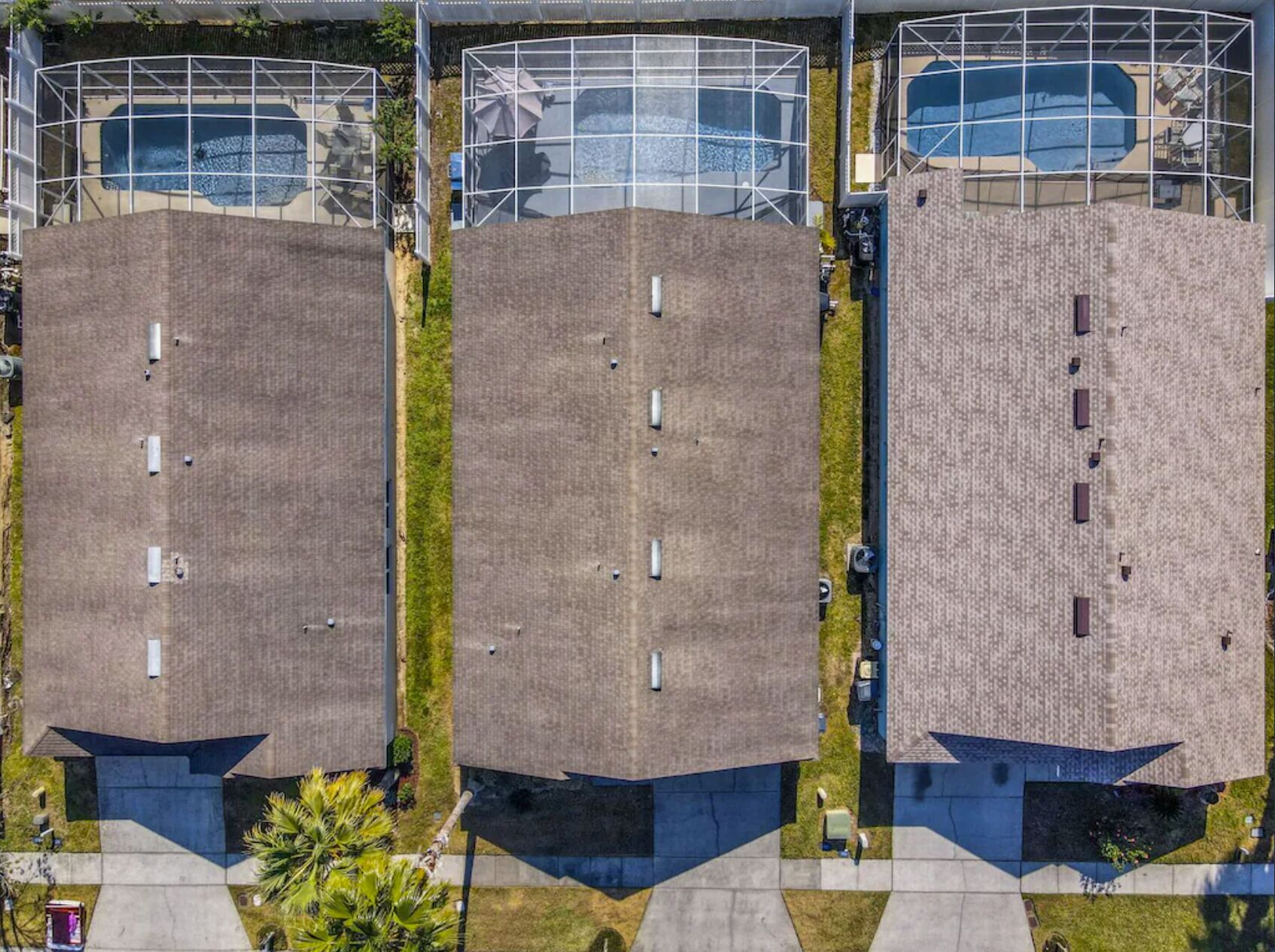 A modern building with a flat roof and a central courtyard.