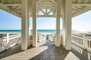 A wooden boardwalk leading to a beach with a white gazebo structure. - Beach Baby: Private beach steps away, Heated pool, FREE golf cart, Bunk room (Miramar Beach)