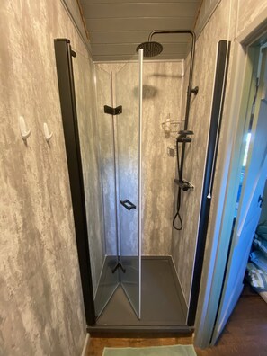 Shower, towels, soap, toilet paper