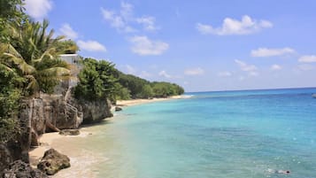 On the beach, sun loungers, beach towels