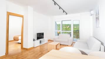 Standard Suite | Living area | Flat-screen TV