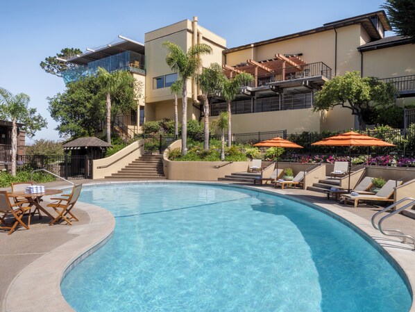 Outdoor pool, open 6:00 AM to 10:00 PM, free cabanas, pool umbrellas