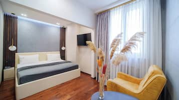 Appartement Deluxe | 1 chambre, coffres-forts dans les chambres, rideaux occultants