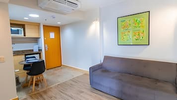 Apartment | Living area | 30-inch TV with cable channels