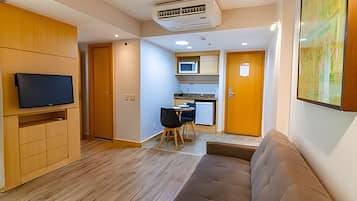 Apartment | Living area | 30-inch TV with cable channels