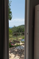 Deluxe Triple Room, Sea View | Terrace/patio