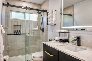 Shower, hair dryer, towels, soap