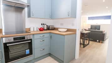 Fridge, electric kettle, toaster, cookware/dishes/utensils