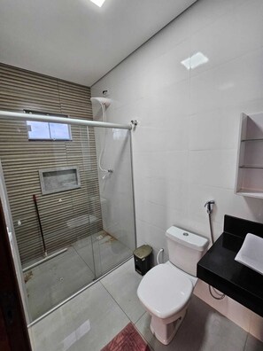 Shower, towels, soap, toilet paper