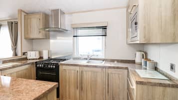 Fridge, electric kettle, toaster, cookware/dishes/utensils