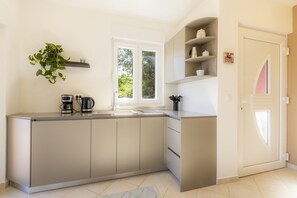 Fridge, microwave, stovetop, coffee/tea maker