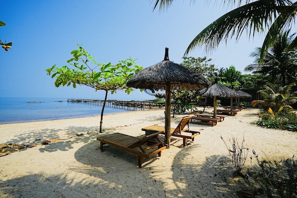 Private beach, beach umbrellas, beach towels, beach bar