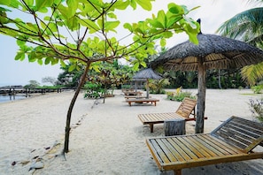 Private beach, beach umbrellas, beach towels, beach bar