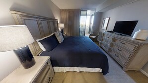 A hotel room with a large bed, a television, a dresser, and a window with curtains. - Jetty View at Jetty East! Three Bedroom/Two Bathroom Unit! One FREE Beach Chair (Destin)