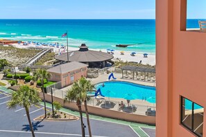 A resort with a swimming pool, beach area, and a view of the ocean. - Sunrise gulf view/beach front condo! Enjoy one free beach chair set up each day (Destin)