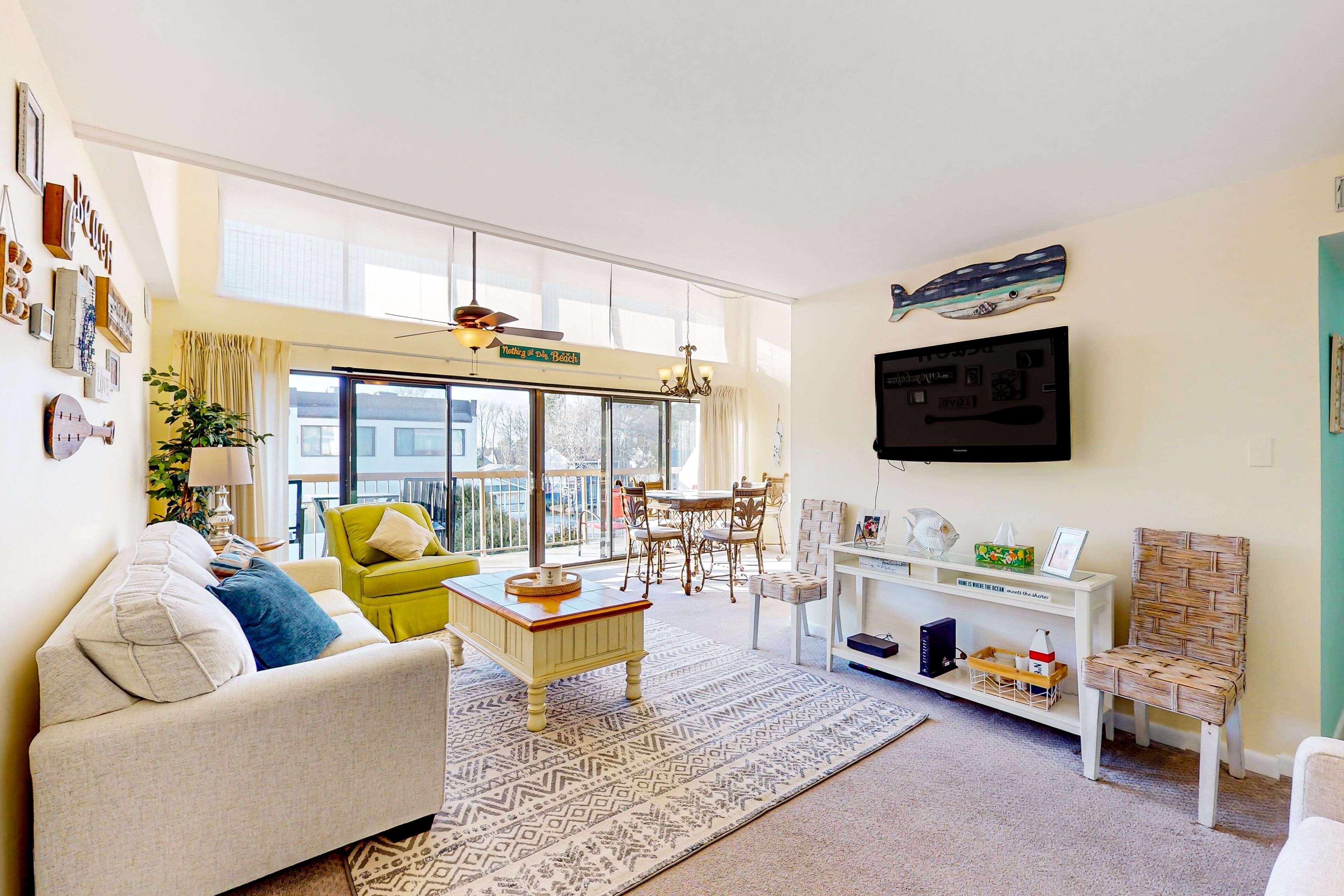 Colorful condo near the beach full of light with balcony, open layout, & TVs