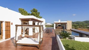 A villa with a pool, outdoor seating, and a pergola. - Villa Dalt S Era with Mountain View, Wi-Fi, Air Conditioning, Pool & Garden (Santa Gertrudis de Fruitera)