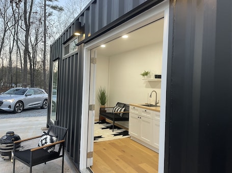 Terrace/patio. Luxury modern container home in a rural setting! Pet friendly!