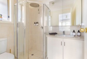 Shower, hair dryer, towels, soap