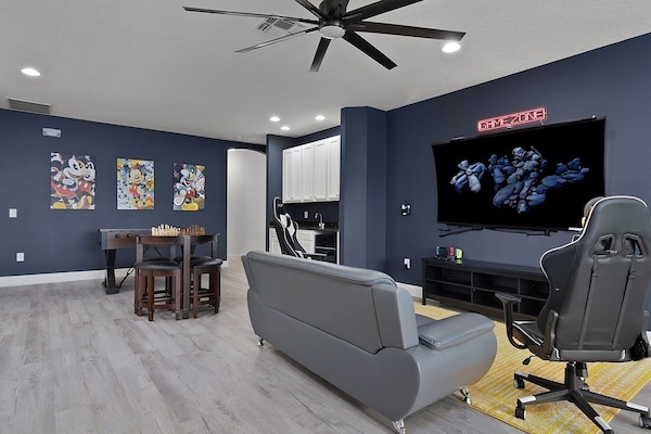 Game Room with WII Switch Gaming Area 70" 4K HDTV & Gaming Chairs